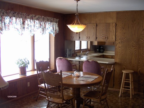 dining room shows opening to the kitchen.  located right off of living room.