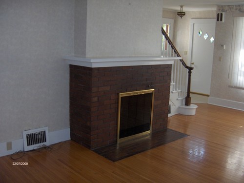 fireplace in livng room with wood floors