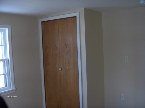 bedroom one closet, new flooring and light.