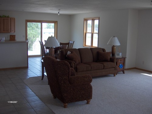 lliving & dining area new furniture used to show how home will look furnished.