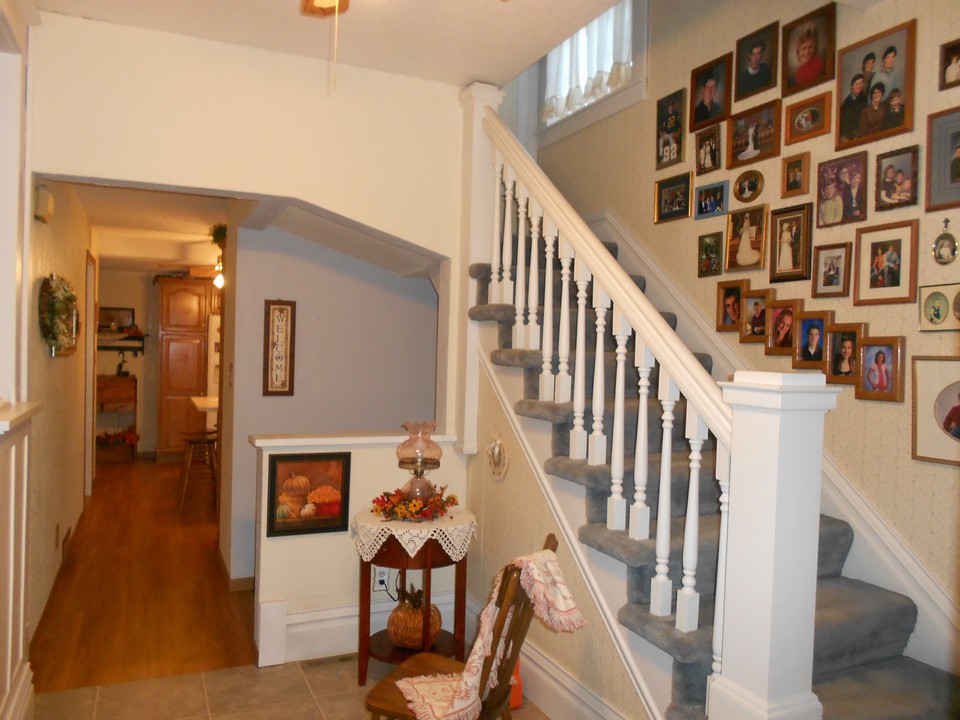 open stairway and entrance to the kitchen