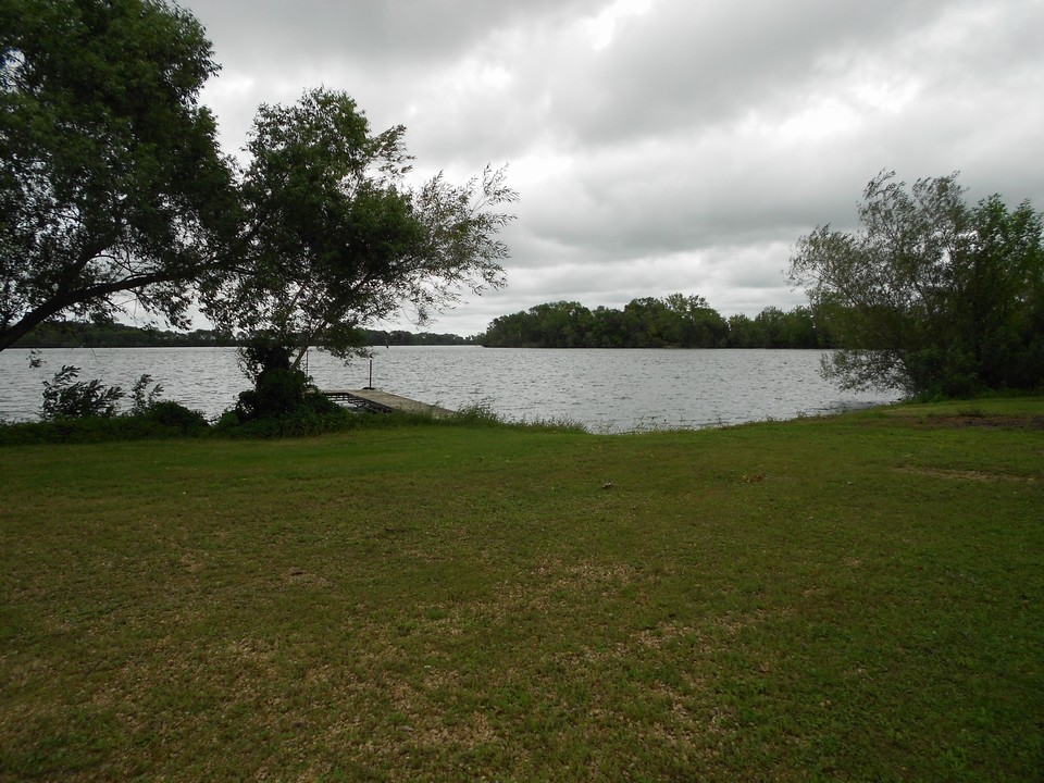 view of lake and dock very flat area and private boat landing
