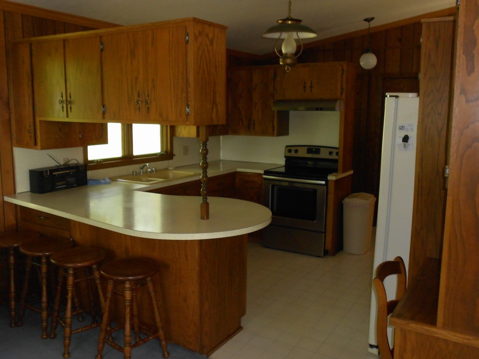 kitchen newer stove and nice eating area.