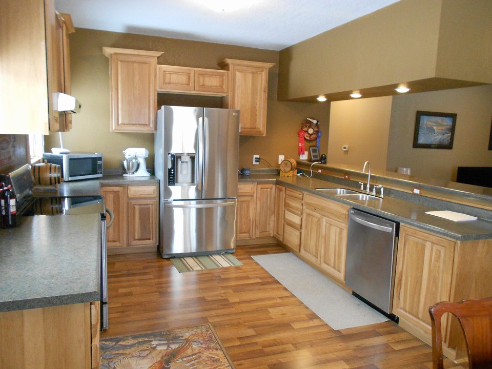 kitchen high quality stainless steel appliances.  open bar to the living area.
