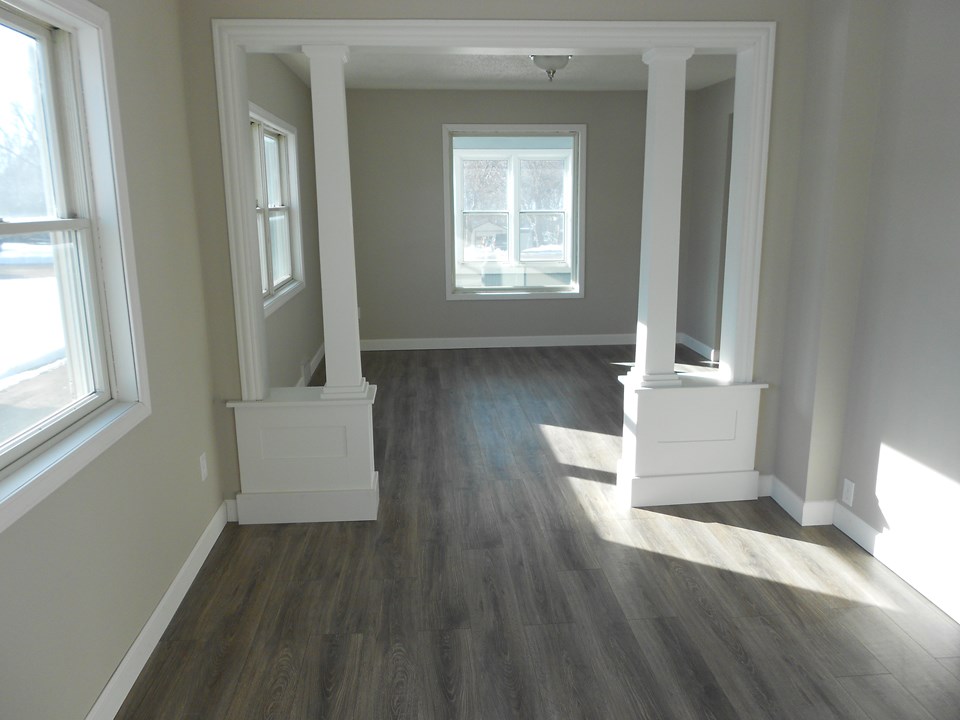 dining and living room lots of natural light.  all new sheetrock.