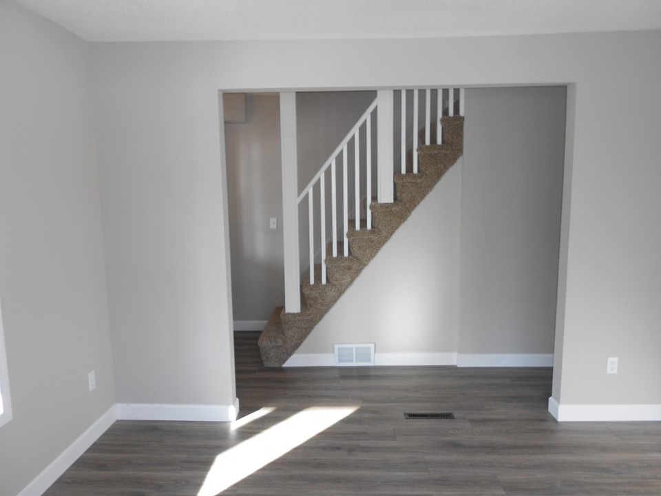 open to stairs new bannister.  new carpet.  very open.