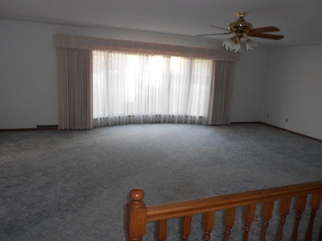 living room with open stairway to basement