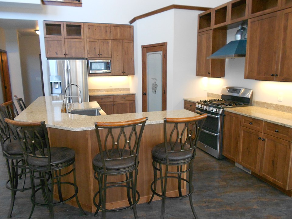 kitchen cambria. gas stove/grill.  double drawer dishwasher.  stainless farmer's sink.