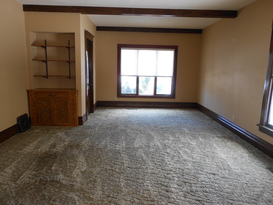 living room high ceilings. character windows. nice woodwork.
