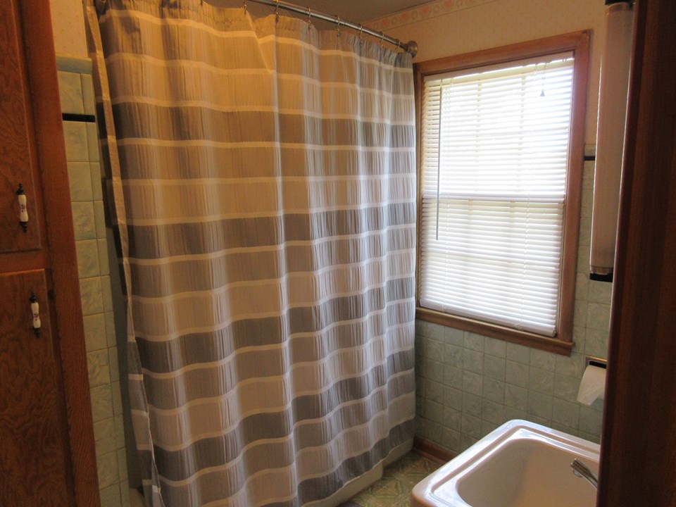 full bathroom located right next to the three bedrooms.