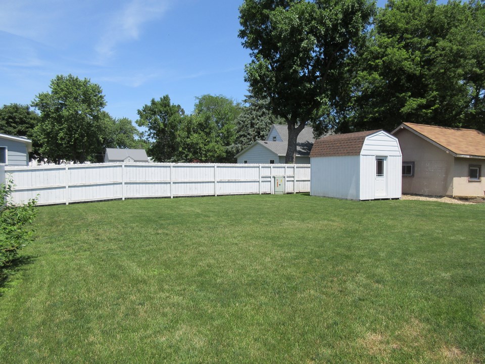 backyard with fence and shed