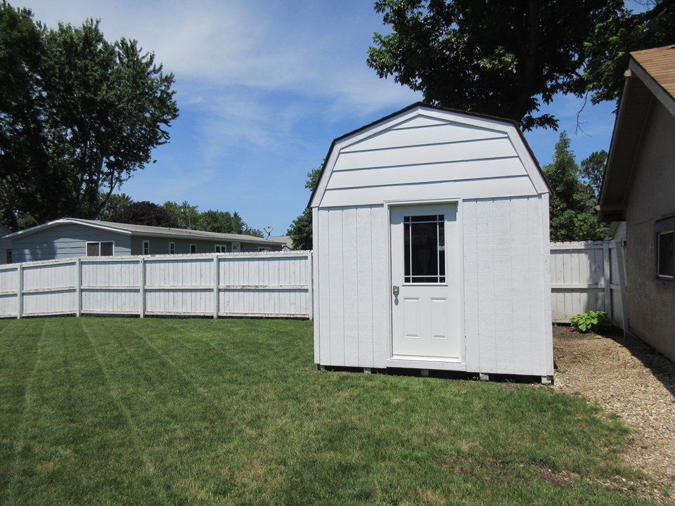 shed the shed has it's own electricity and a wood floor.