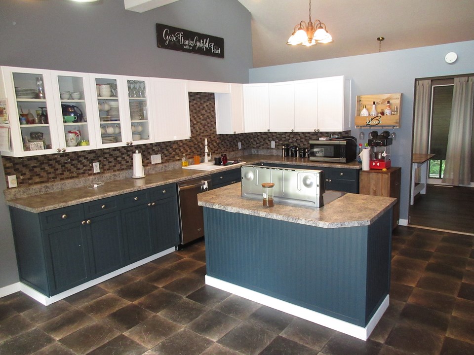 kitchen newer backsplash. access to the dining room and the living room. door to garage.