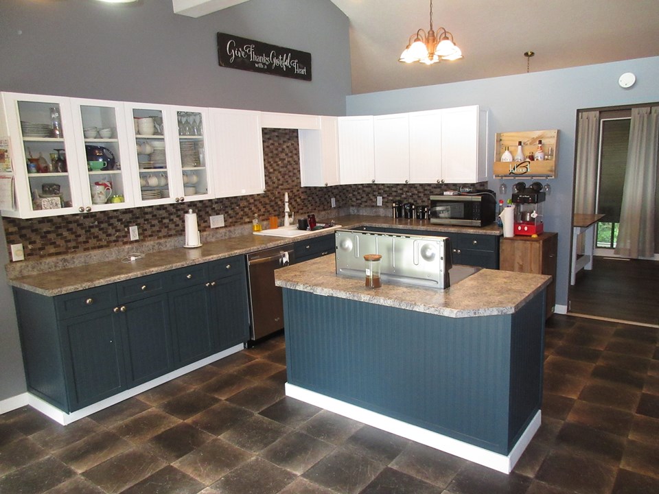 kitchen newer backsplash.  access to the dining room and the living room.  door to garage.