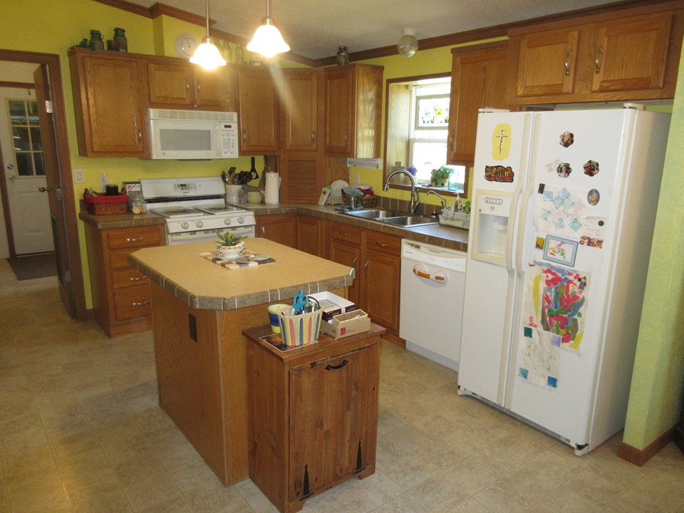 kitchen with island appliances are staying.