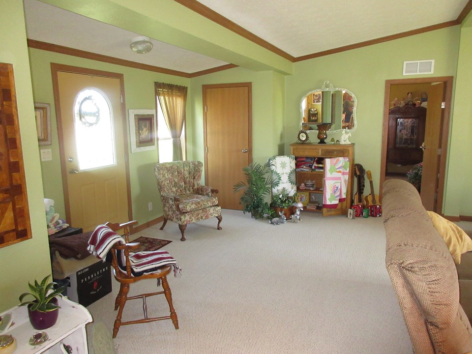 front entry area open to the living room 18 by 27 are the dimensions of the living room.