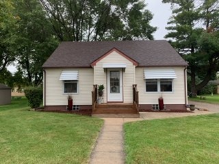 front of home new shingles in 2019, vinyl siding, newer front steps, foundation recently painted.