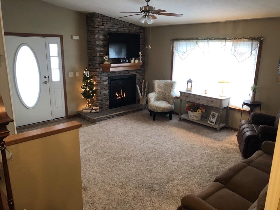 living room custom brick gas fireplace. hunter douglas blinds.