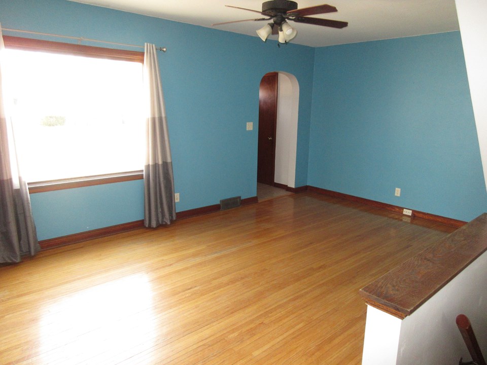 living room hardwood floors and big window