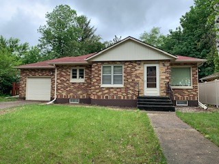 front of home attached garage with an opener.