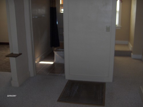 view from living room to the left of closet door bathroom, then bedroom. to the right leads to bedroom and the upstrairs