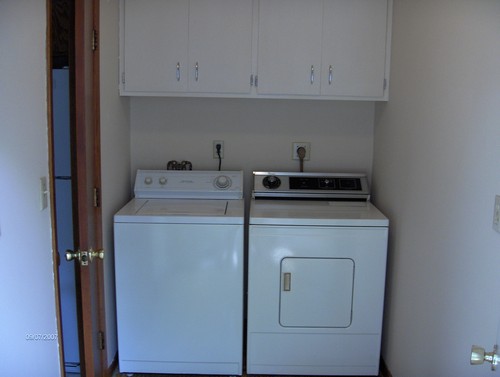 utility room off ktchen also has back door leading to patio and backyard