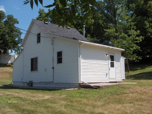 double windows face street back door leading from kitchen