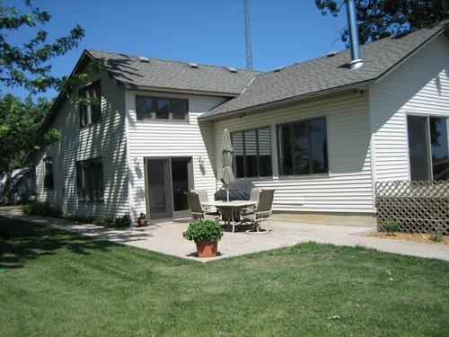 back of house private patio with room for a hot tub.