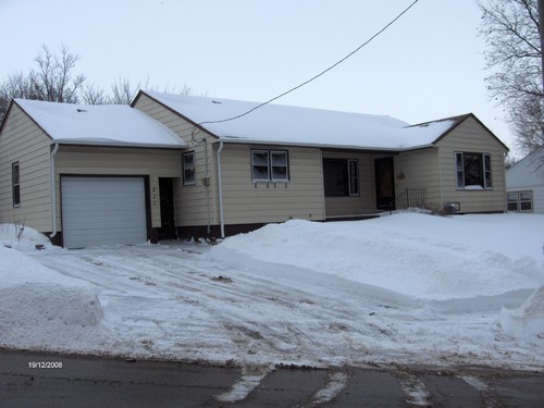 front of house nice roof, permanent siding, and an attached garage.