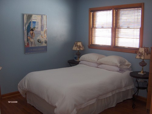 large bedroom with hardwood floor.