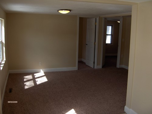 living room new windows, flooring, trim and lights.