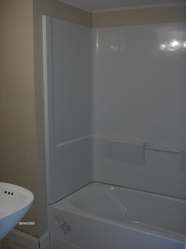 bathroom new tub, shower, and surround. flooring and sink are new also.
