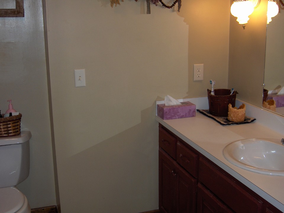 upstairs full bathroom with bath and shower