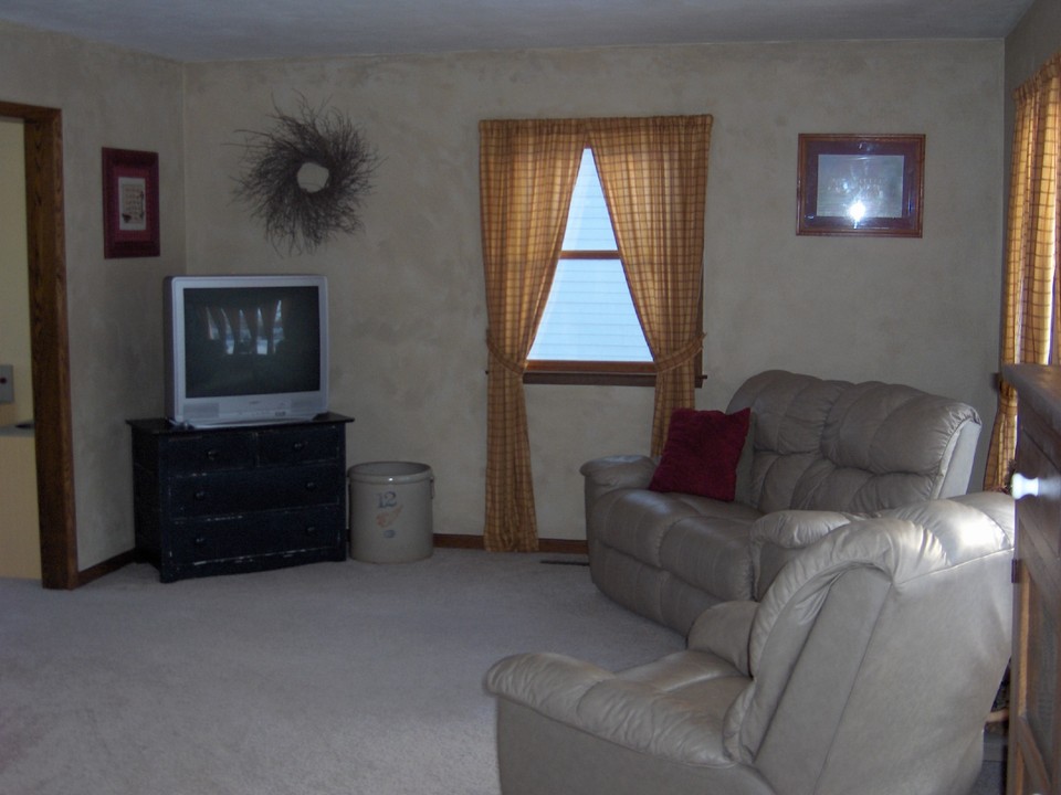 main floor living room taken from the entry area. doorway goes to formal dining room.