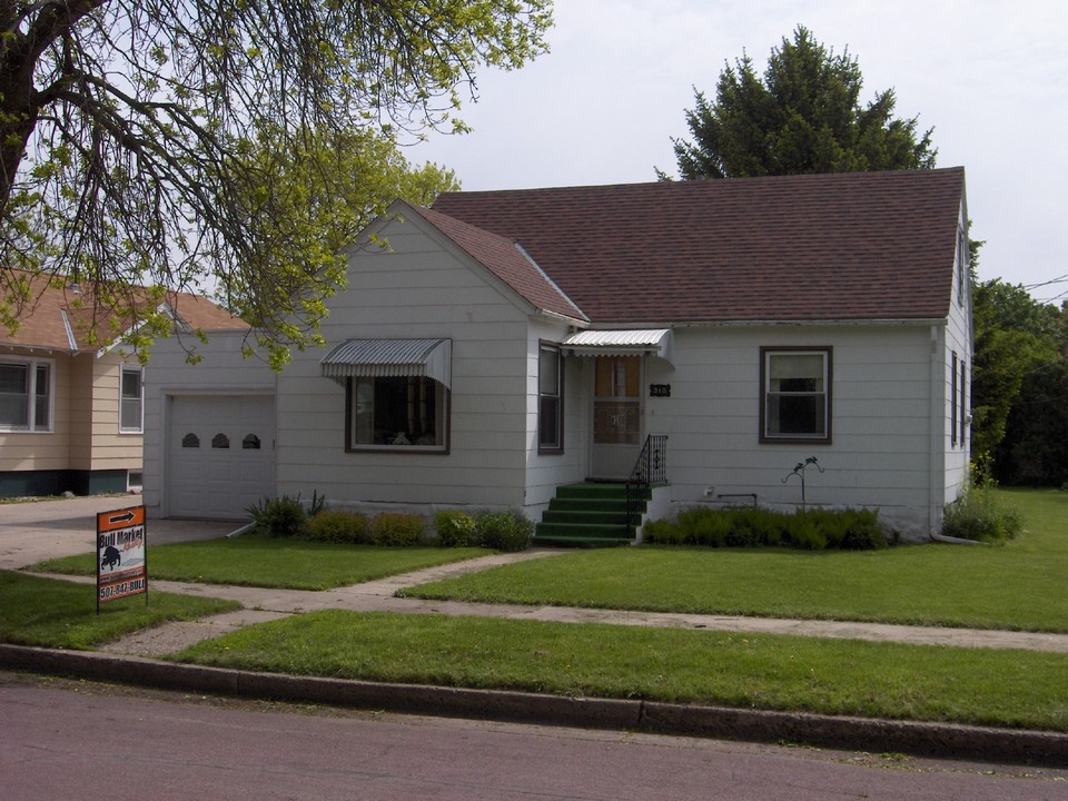 front of house newer roof and windows. attached garage.