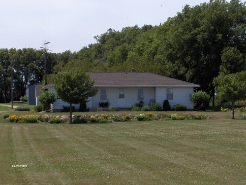 front beautiful front lawn with butterfly garden.