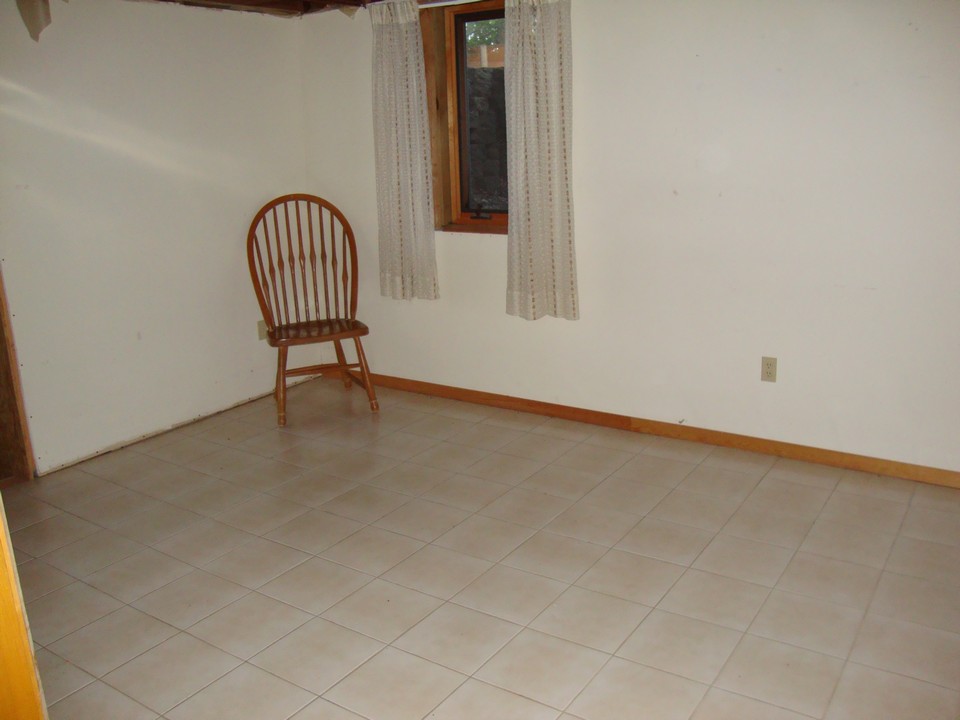 potential bedroom in basement with egress window