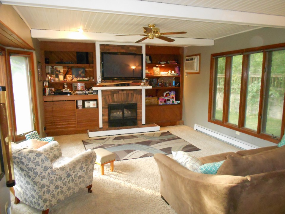 family room lots of light and a fireplace