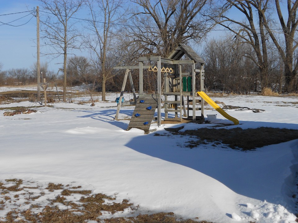 backyard lot is 50 by 150. swingset is included.