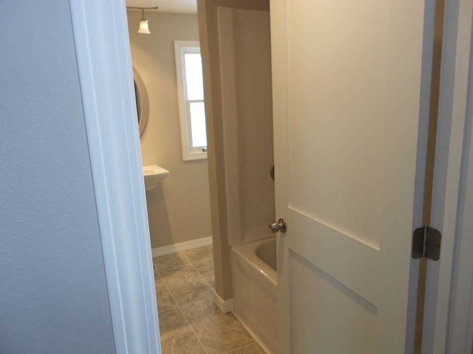 bathroom tub and shower with a surround