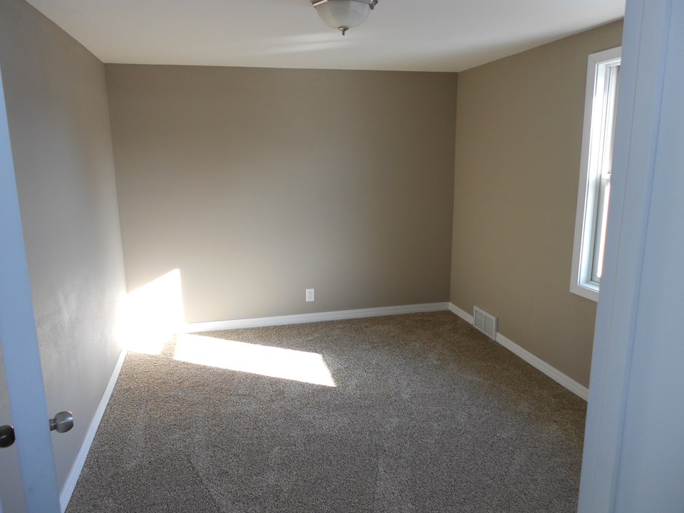 one of three bedrooms