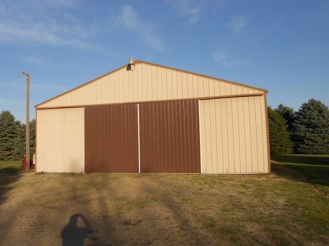 nice older building with a dirt floor for cold storage.