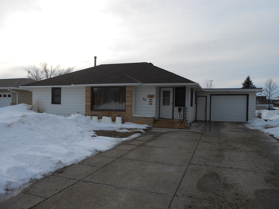 front of home nice big driveway with attached garage