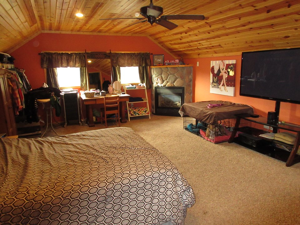 large bedroom with gas fireplace