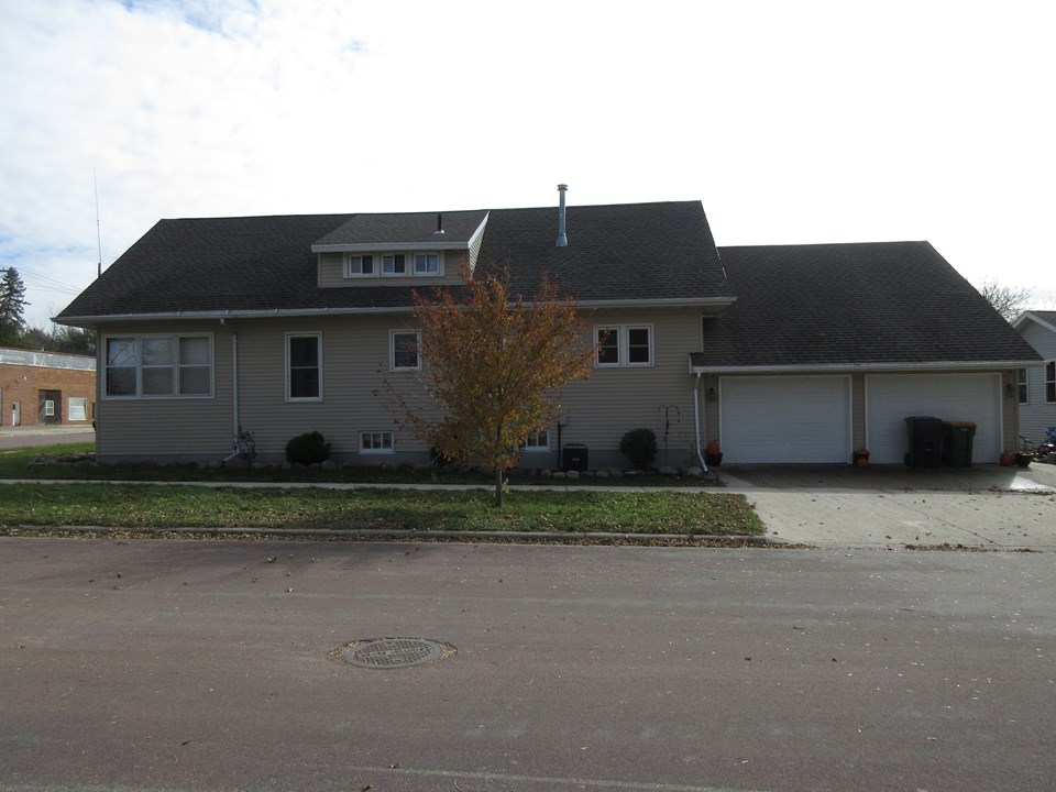 side view of home huge garage with finished living area above.