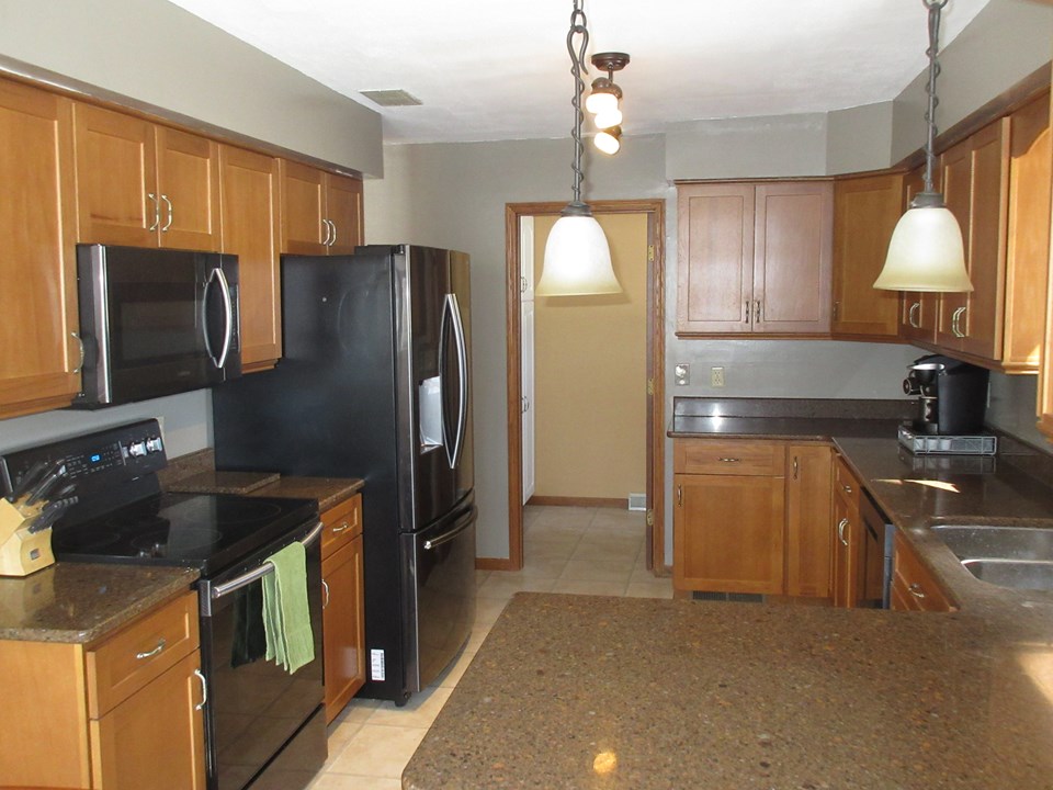 very modern kitchen door leads to main floor laundry