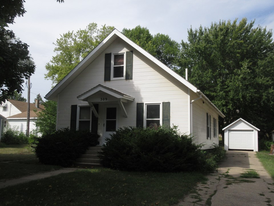 front of home great location. vinyl siding. single detached garage.