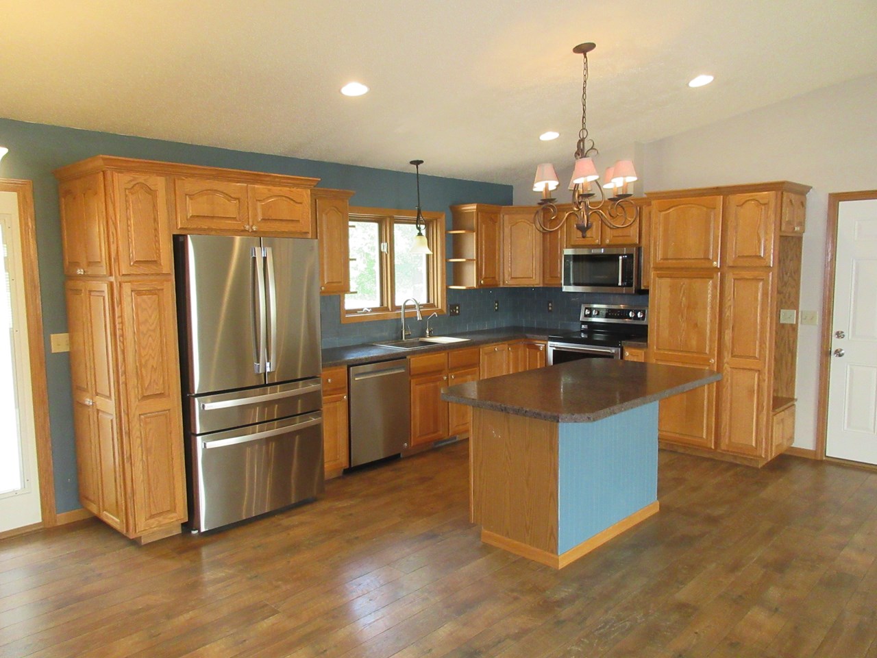 kitchen stainless steel appliances. lots of cupboards.