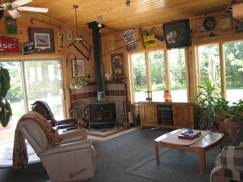 sun room with a wood burning stove