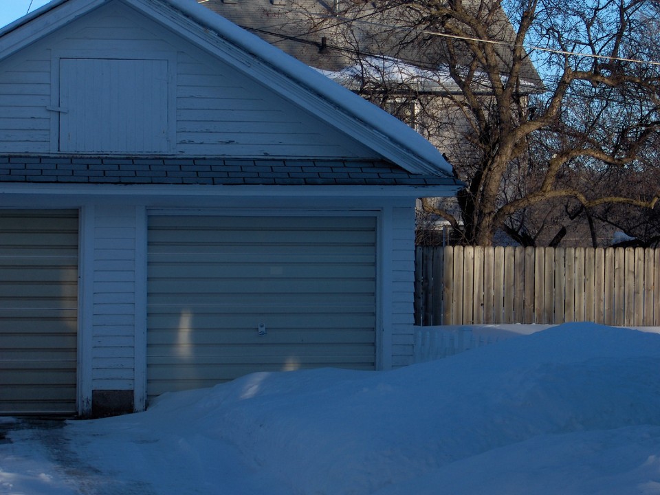 shared garage fenced in backyard